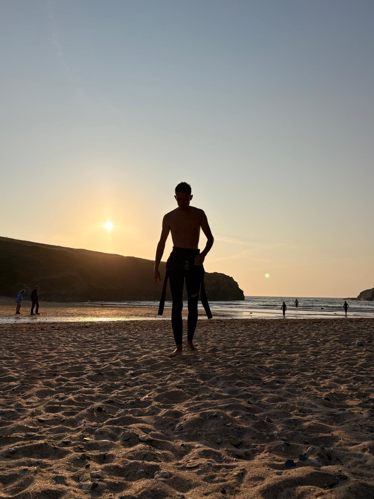 Matt Thompson on the beach at sunset